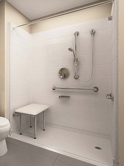 Installed white walk-in shower kit with a low threshold entry, stainless grab bars and a fold-down seat